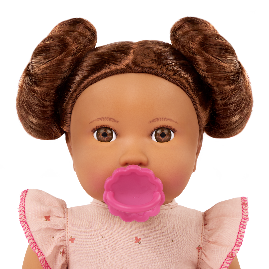 LullaBaby doll with brown hair in pink outfit