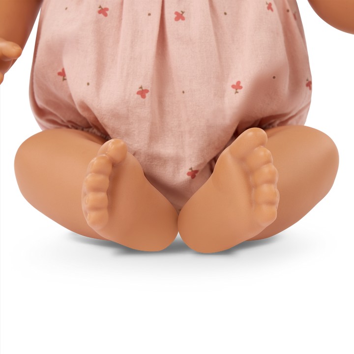 LullaBaby doll with brown hair in pink outfit